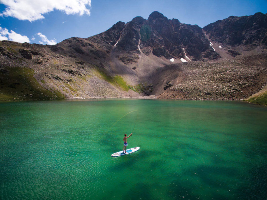 Paddle boarding mountain lake